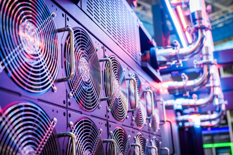 Close-up of server cooling fans in a vibrant data center